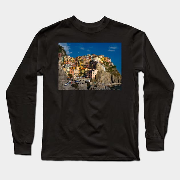 View on the cliff town of Manarola, one of the colorful Cinque Terre on the Italian west coast Long Sleeve T-Shirt by Dolfilms